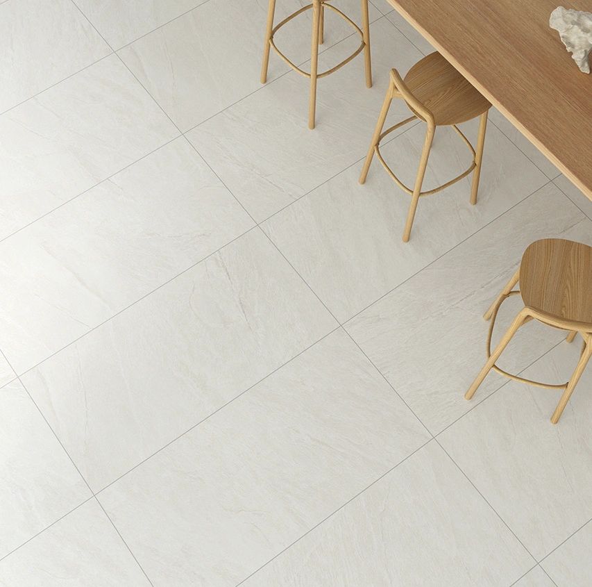 Helsinki tile 24in by 48in porcelain rectified tile with beige gold sand stone finish on floor