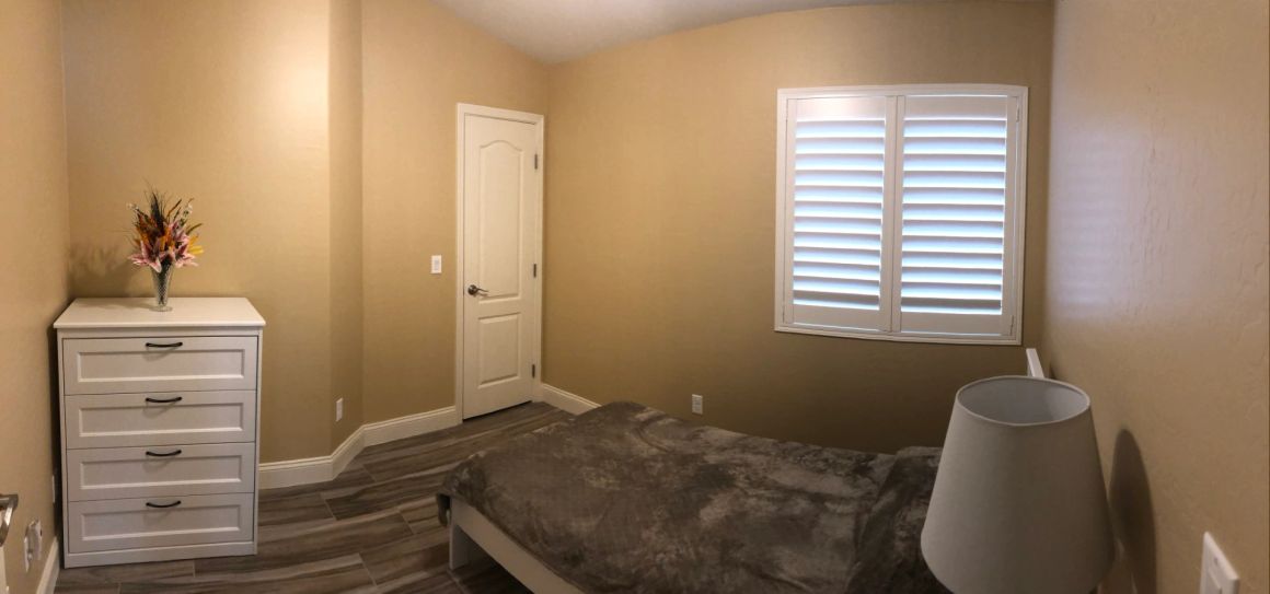 Bedroom shown at Marigold at Redwood Assisted Living Home.