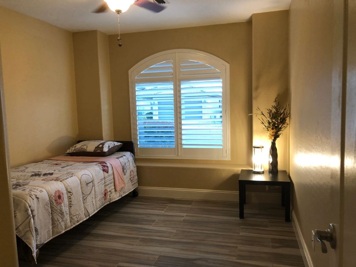 Bedroom shown at Marigold at Redwood Assisted Living Home.