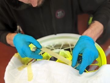 Masking a motorcycle rim to paint in a second colour