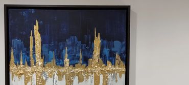 Square abstract art with blue abstract city scape skyline with blue and white background and gold