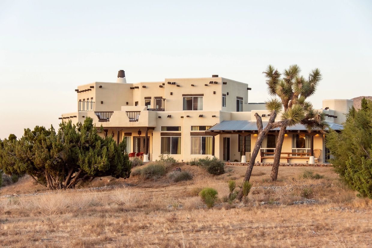 A southwestern style house in a desert landscape.
