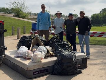 Group of people with the litter collected from Woodland Basin Nature Area in Garland, TX