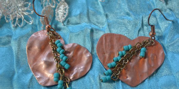 A peaceful landscape featuring lush greenery, a calm river, and a clear blue sky.