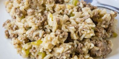 Close-up of a creamy ground beef and rice casserole.