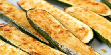Baked zucchini boats with a golden cheesy topping.