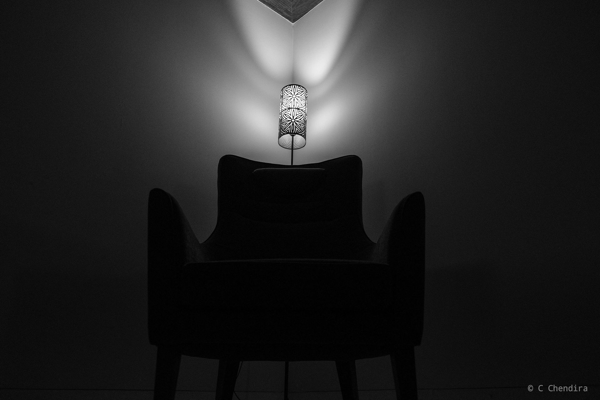 Accent chair silhouette with lighting effect. Black & white. 1/125; f/2.6; ISO-1250; 18 mm APS-C