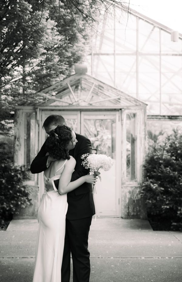 Bride and groom embrace at Luthy Botanical Garden Peoria, Illinois