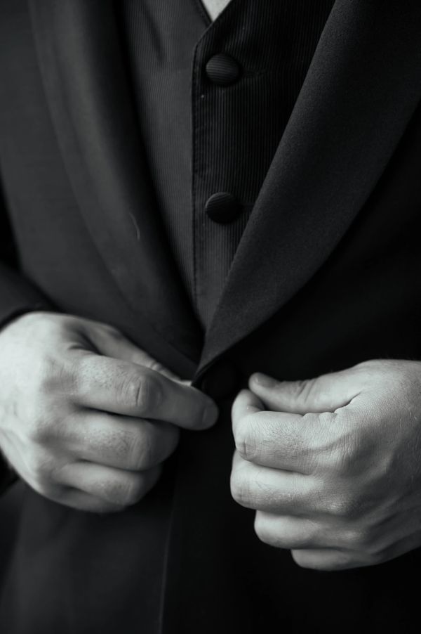 Groom getting ready black and white photo The Barn at Hornbaker Gardens wedding