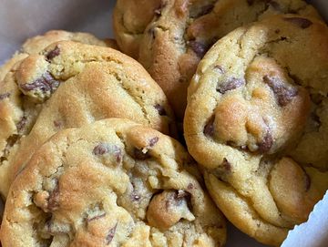 Close-up of freshly baked chocolate chip cookies.