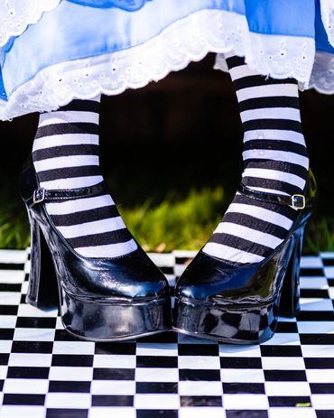 Dark Alice in Wonderland dress tea party  Shoes Stripy tights 
French's Fancy Dress Uckfield Sussex 