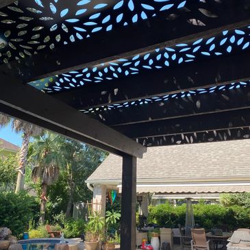 custom cedar pergola with a unique cover
