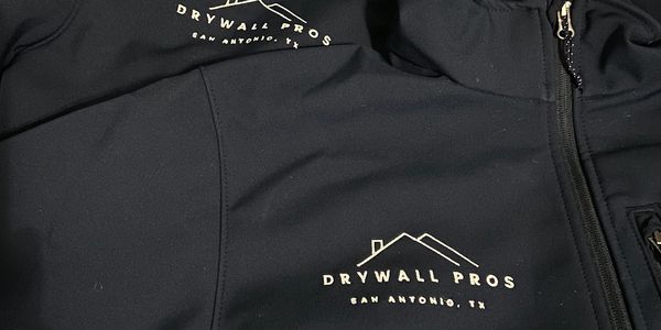 Black jackets with Drywall Pros logo and San Antonio, TX text.