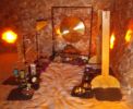 Dimly lit room with orange lanterns and ritualistic setup on the floor.