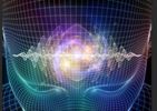 Digital visualization of a human head with sound waves and light effects.