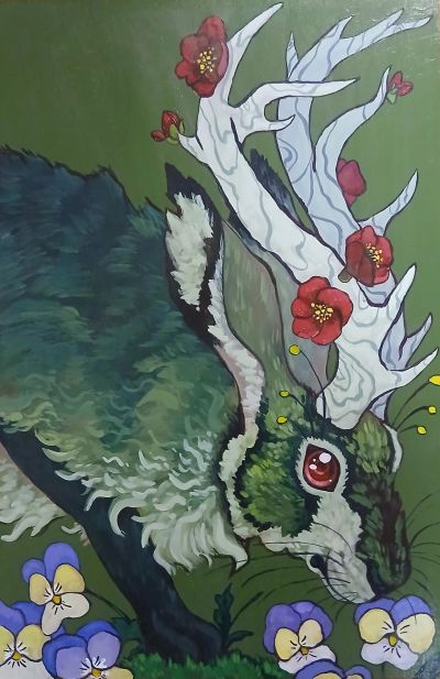 Rabbit with floral antlers among flowers.