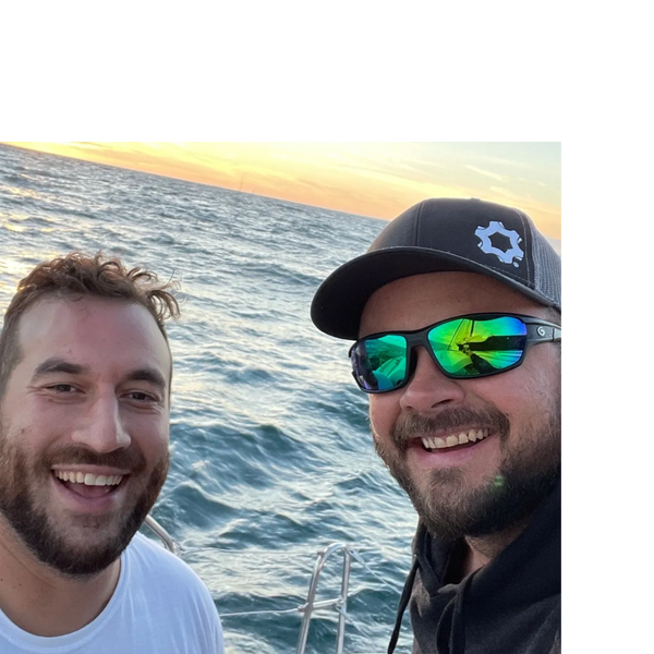 Photo of Sammy Zablen (APG COO) and Bruce Cardenas (APG CEO).  Close up aboard sailboat.