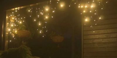 Warm white commercial-grade fairy lights displayed on house veranda.