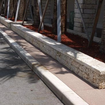 Stone planter on sidewalk
