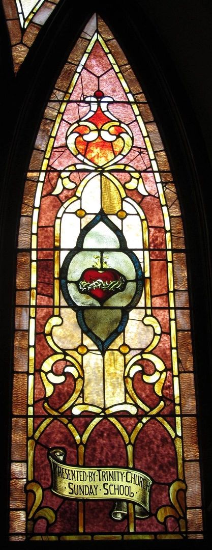 Stained glass window with heart and crown of thorns.