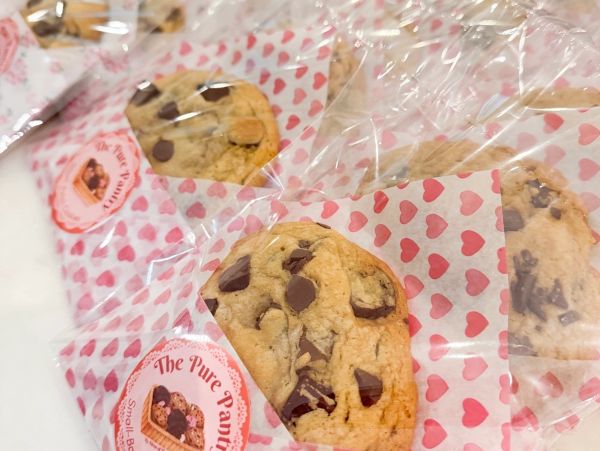 Chocolate chip cookies in heart-patterned packaging.