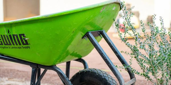 Wheelbarrow for crushed granite used in artificial turf installation base