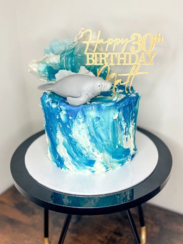 30th birthday cake with wave themed buttercream, rice paper waves and manatee.