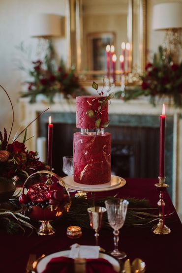 2 tier red winter inspired cake with foliage detail