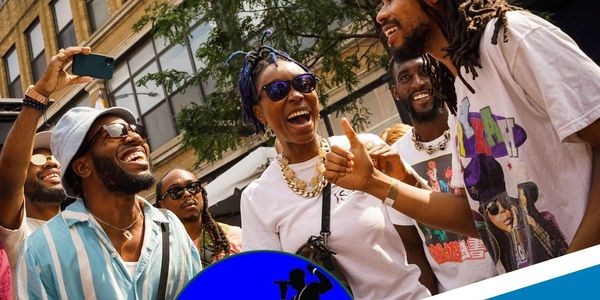 Group of friends joyfully interacting outdoors, promoting mental health through hip-hop referral program.