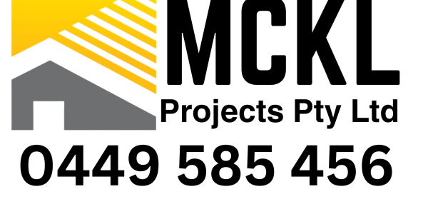 A modern house with a yellow striped roof and grey walls.