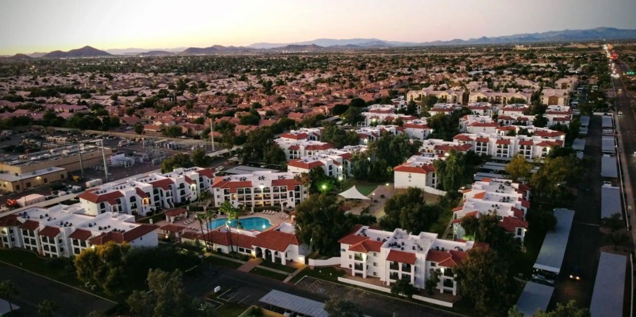 Aerial view of a suburban apartment complex at dusk.