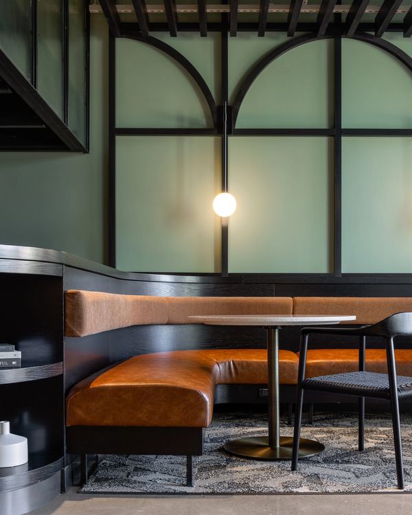 WCI custom banquette and Disc base table