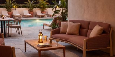 Cozy outdoor seating area by pool.