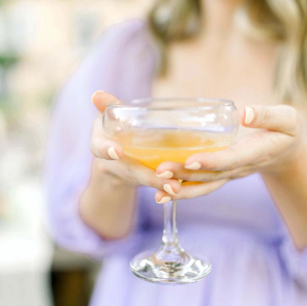 woman holding champagne glass