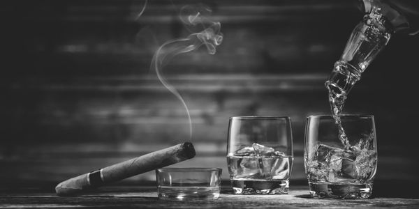 A rite of repose—where legacy lingers in every pour and plume.