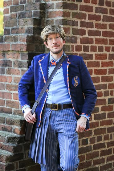 Shiz University uniform from Wicked. Outdoor cosplay photoshoot, hand crafted. Leaning against arch