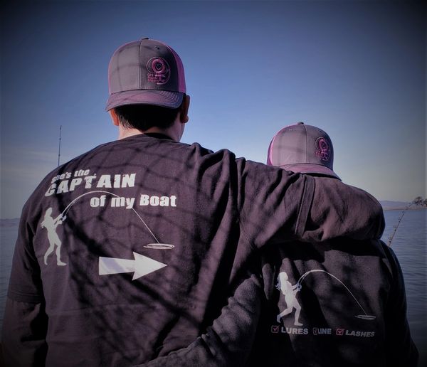 Two people wearing Girl Power Fishing shirts