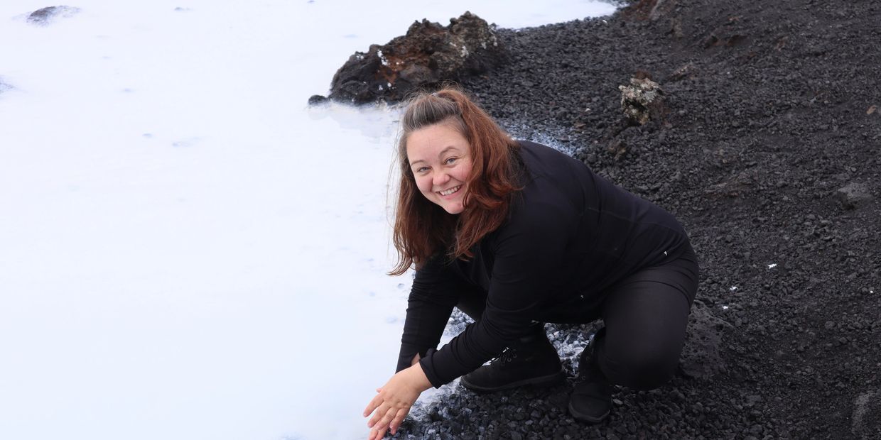 Shannon John rinsing hands in Iceland's Blue Lagoon