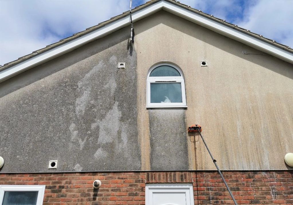 Half-cleaned house wall with a window.