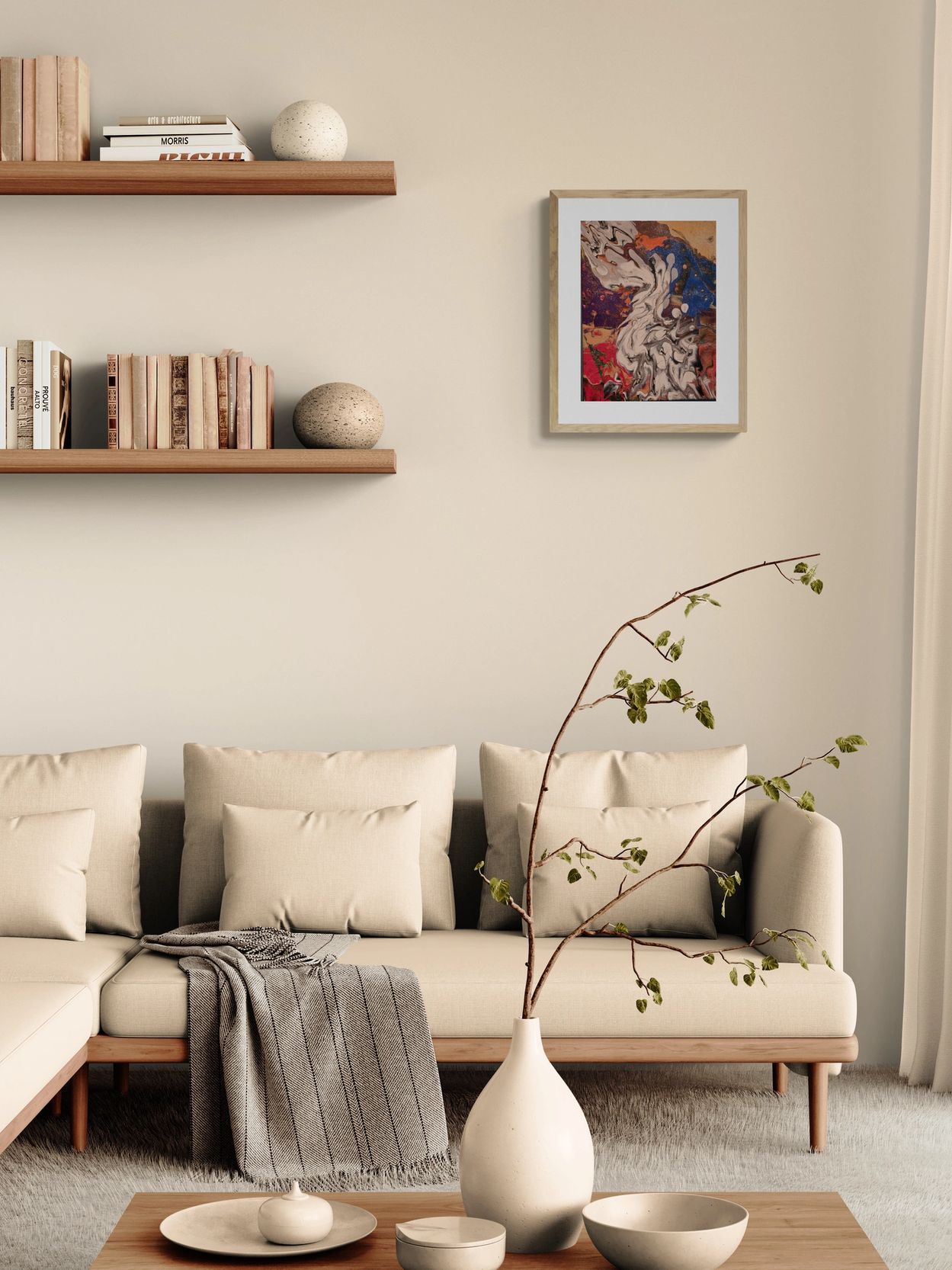 Minimalist beige living room with modern couch, abstract art, and natural decor.