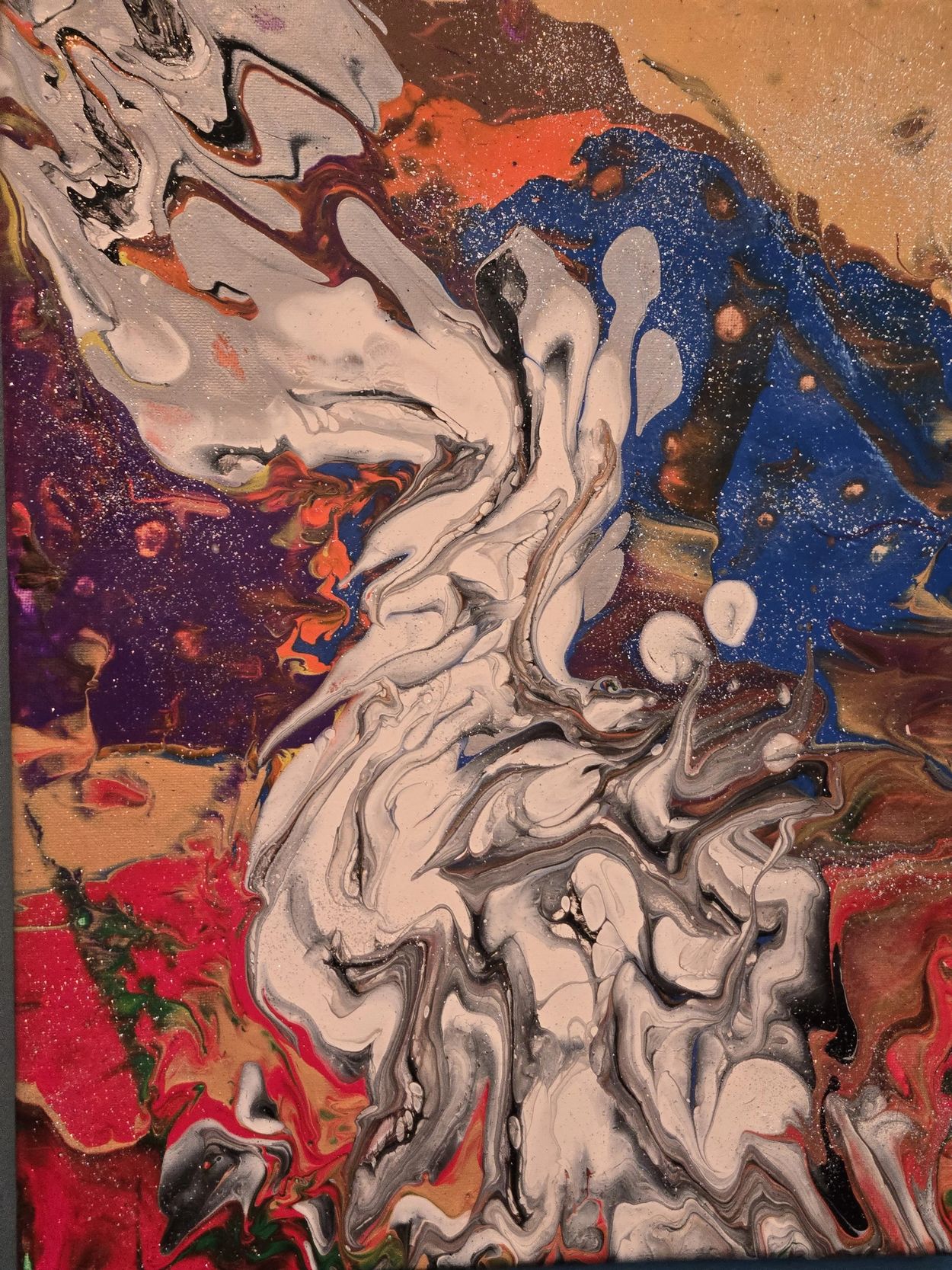 Abstract fluid art with swirling colors of white, red, blue, and purple.