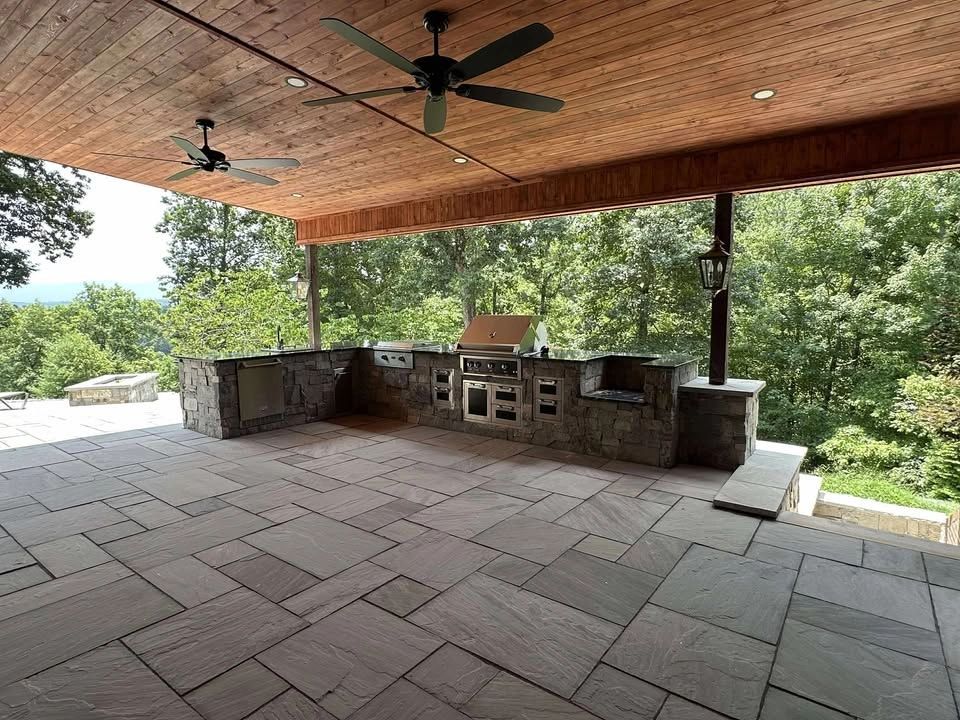 Covered patio with mixed-size paving and an outdoor kitchen