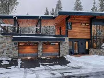 house with steel beams done with structural engineering, and wood siding as part of its architecture