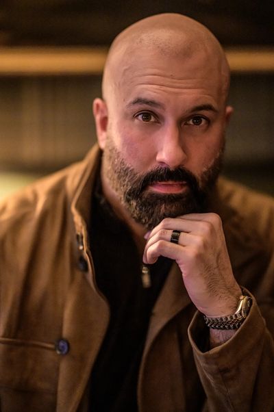 Close portrait of Chaudry Ghafoor in a thoughtful moment.