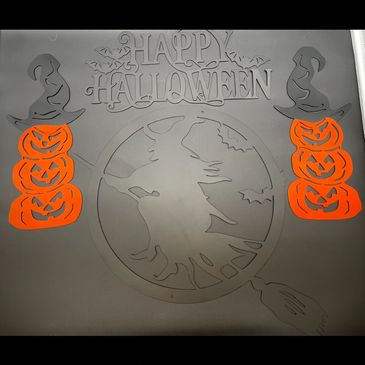 Halloween decoration with witches and jack-o'-lanterns.