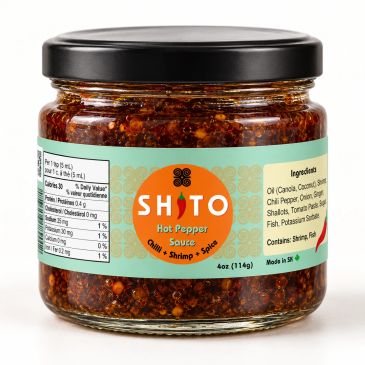 Jar of Shito hot sauce with chili, shrimp, and spice.