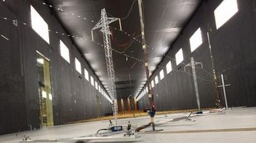 Wind tunnel testing of miniature power transmission towers and lines.