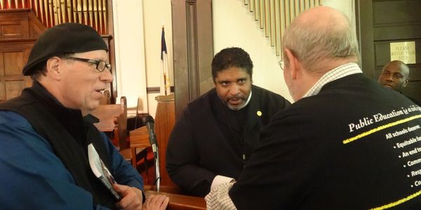 Dr. Turner having a conversation with two people 