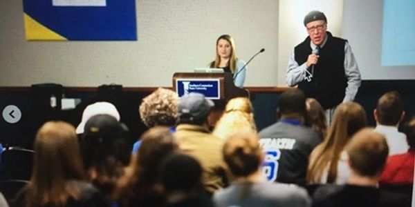 Dr. Turner speaking in front of people 