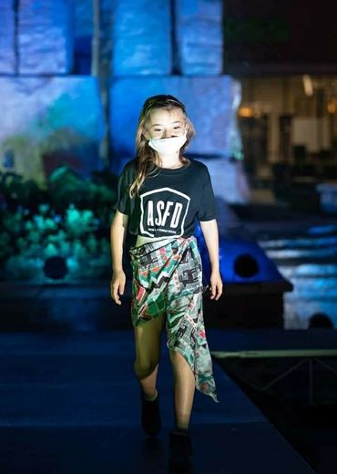 Little girl parading the runway fashion show